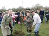 Dr Murray Gray, Brian Hewlett and the youngest and oldest members of the village plant a tree in the centre of the wood