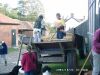 What's left of the apples after pressing is loaded into the trailer to be spread on the fields